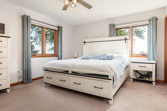 a bedroom with a bed and a night stand