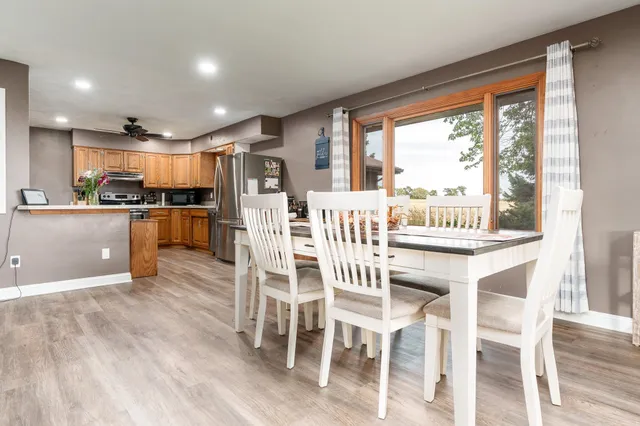 a kitchen with stainless steel appliances granite countertop a refrigerator and a stove top oven