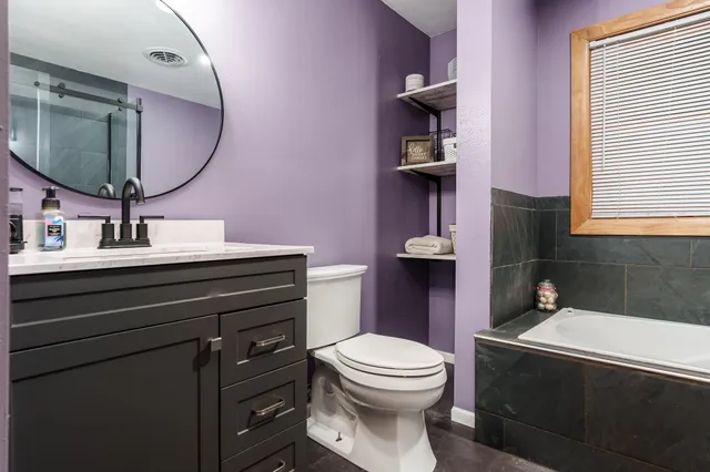a bathroom with a bathtub and a sink