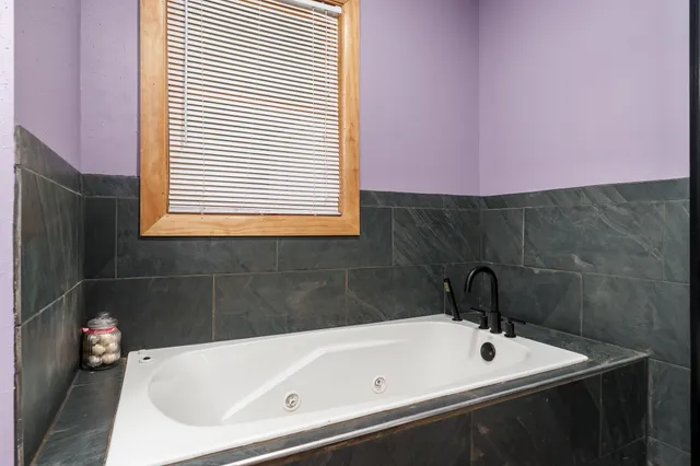 a bathroom with a glass shower door