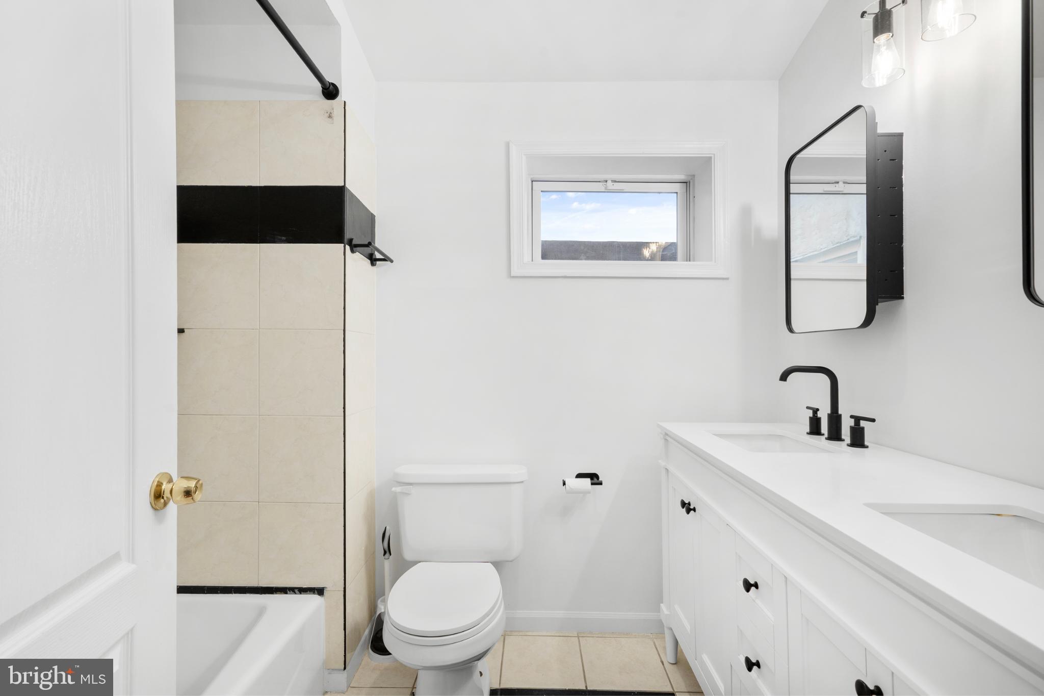 944 North Randolph Street Philadelphia, PA 19123 - Photo 18 of 26 a bathroom with a toilet sink and mirror