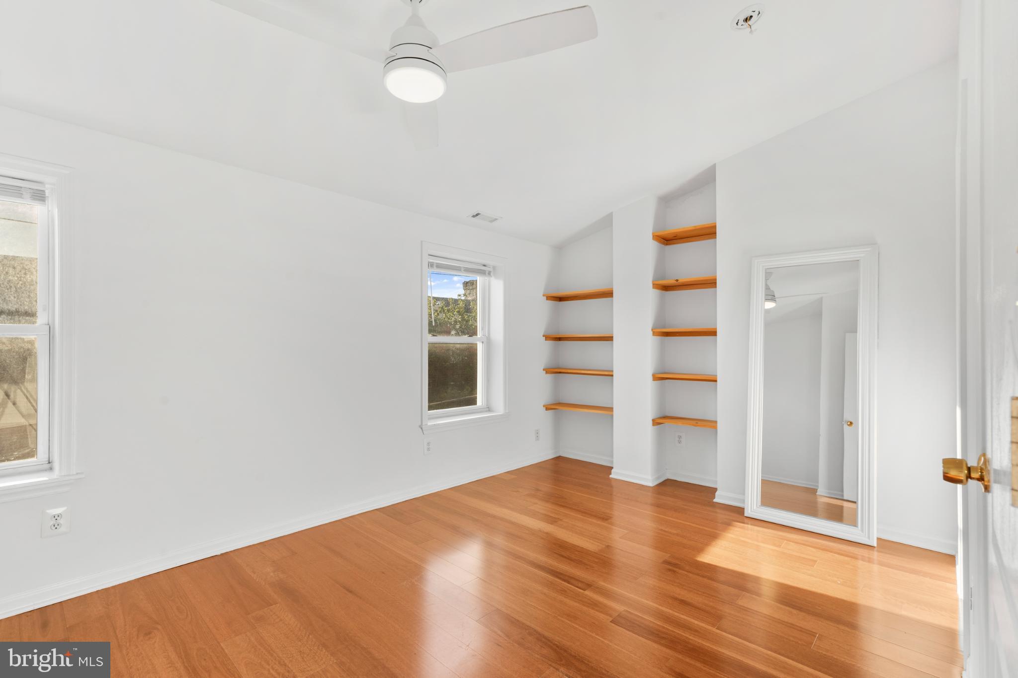 944 North Randolph Street Philadelphia, PA 19123 - Photo 22 of 26 a view of empty room with wooden floor and fan