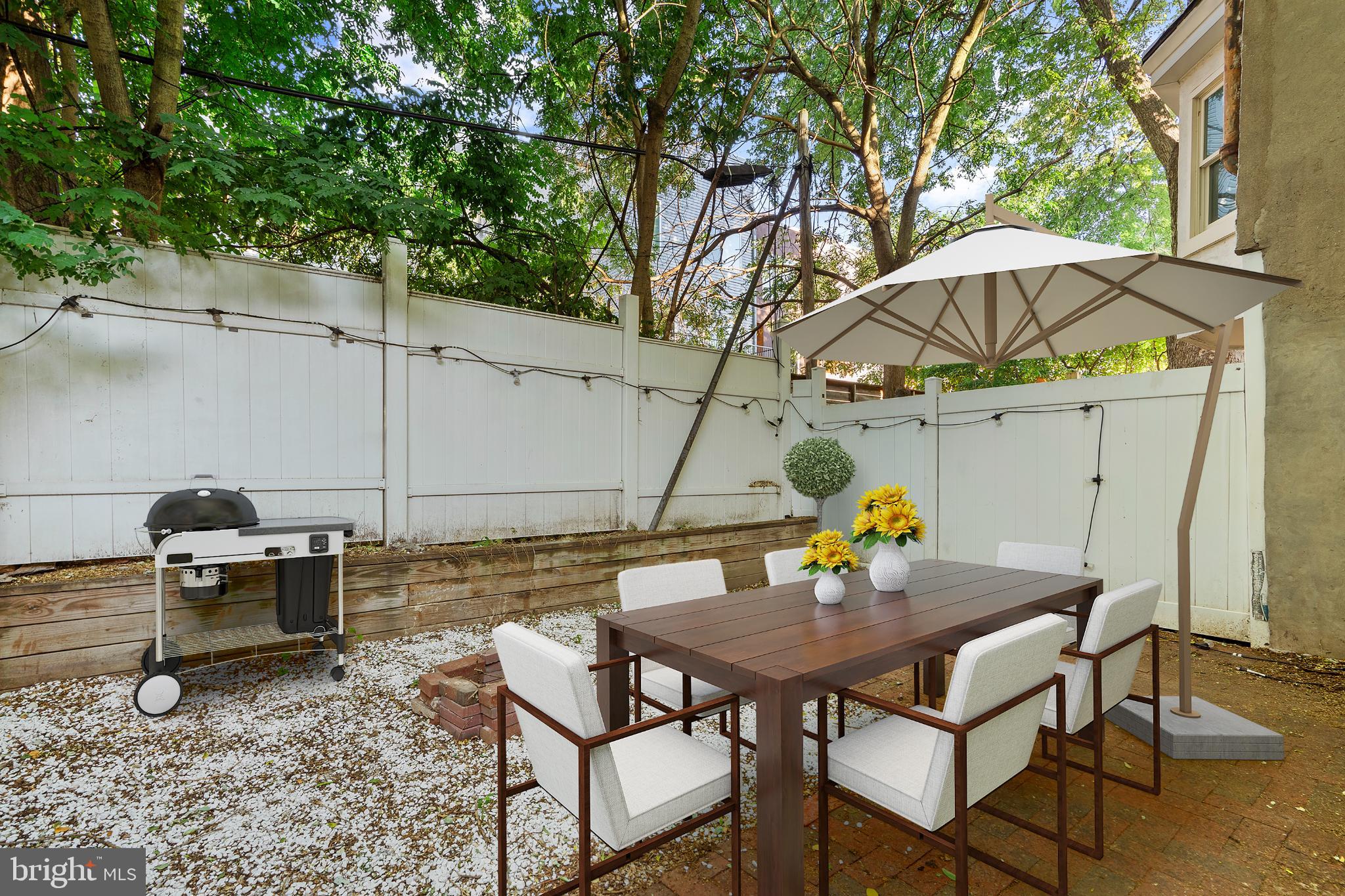 944 North Randolph Street Philadelphia, PA 19123 - Photo 24 of 26 a view of an outdoor sitting area with couch and umbrella