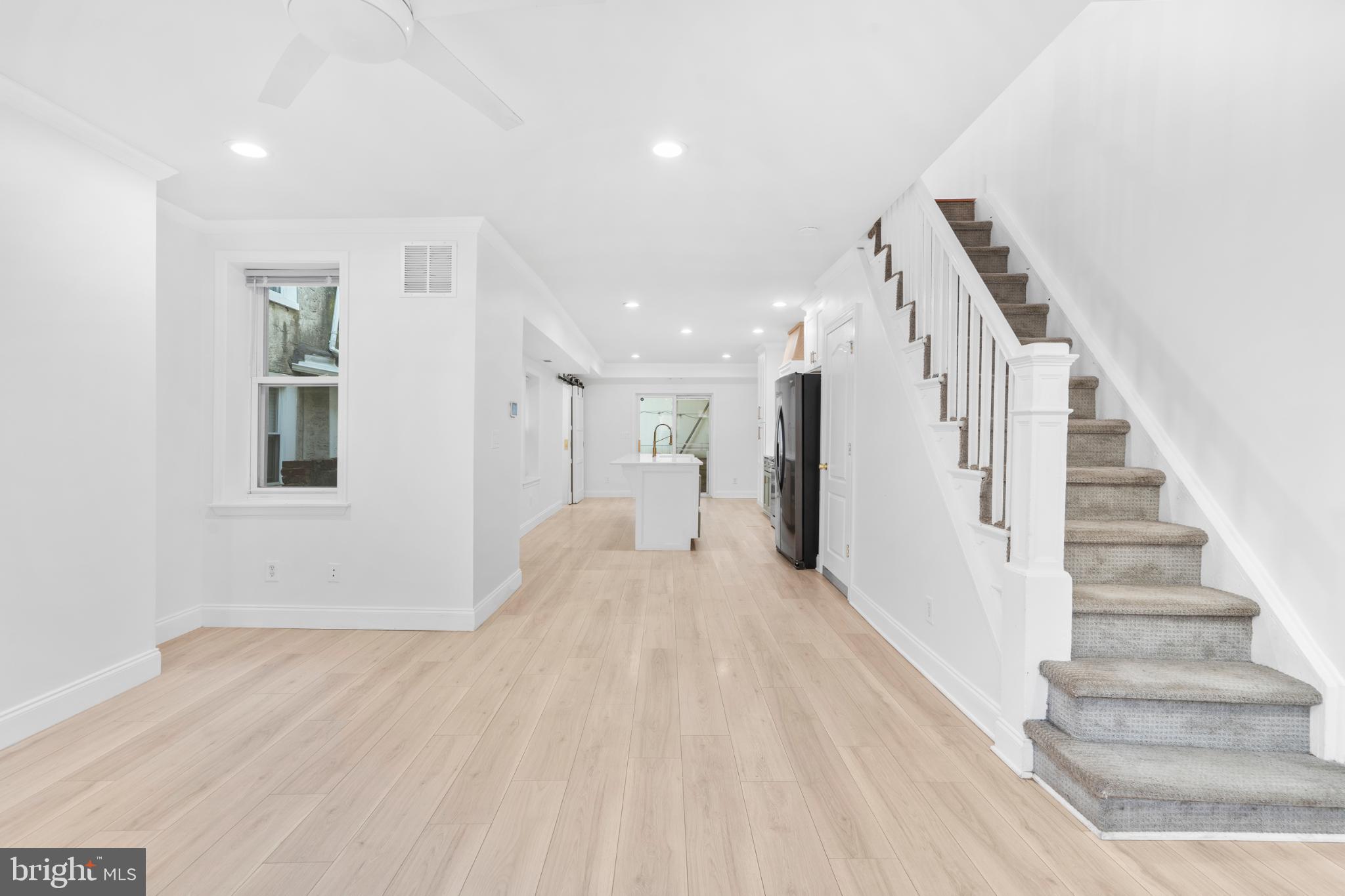 944 North Randolph Street Philadelphia, PA 19123 - Photo 4 of 26 a view of a hallway with wooden floor and staircase