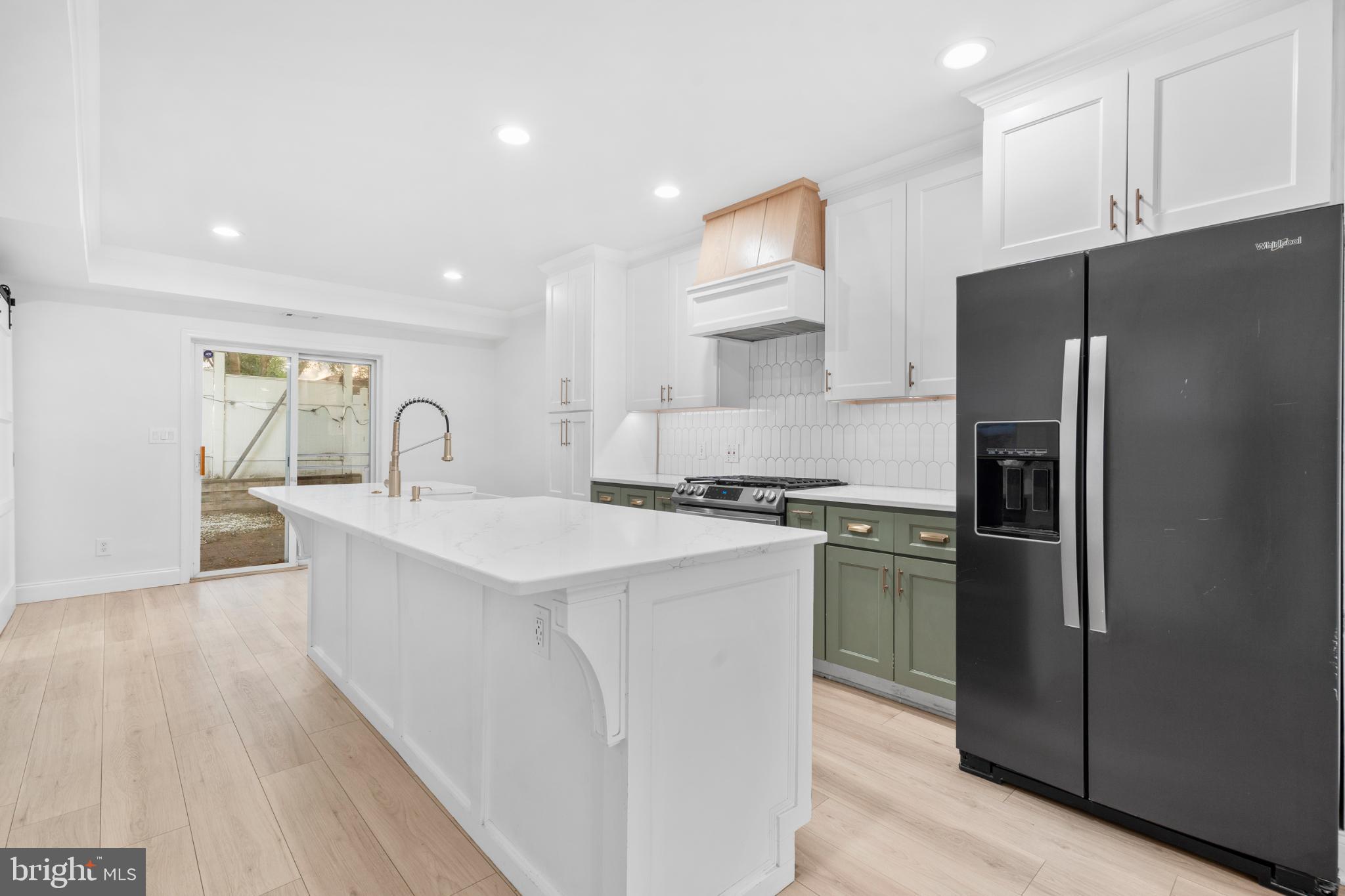 944 North Randolph Street Philadelphia, PA 19123 - Photo 6 of 26 a kitchen with refrigerator a sink and cabinets