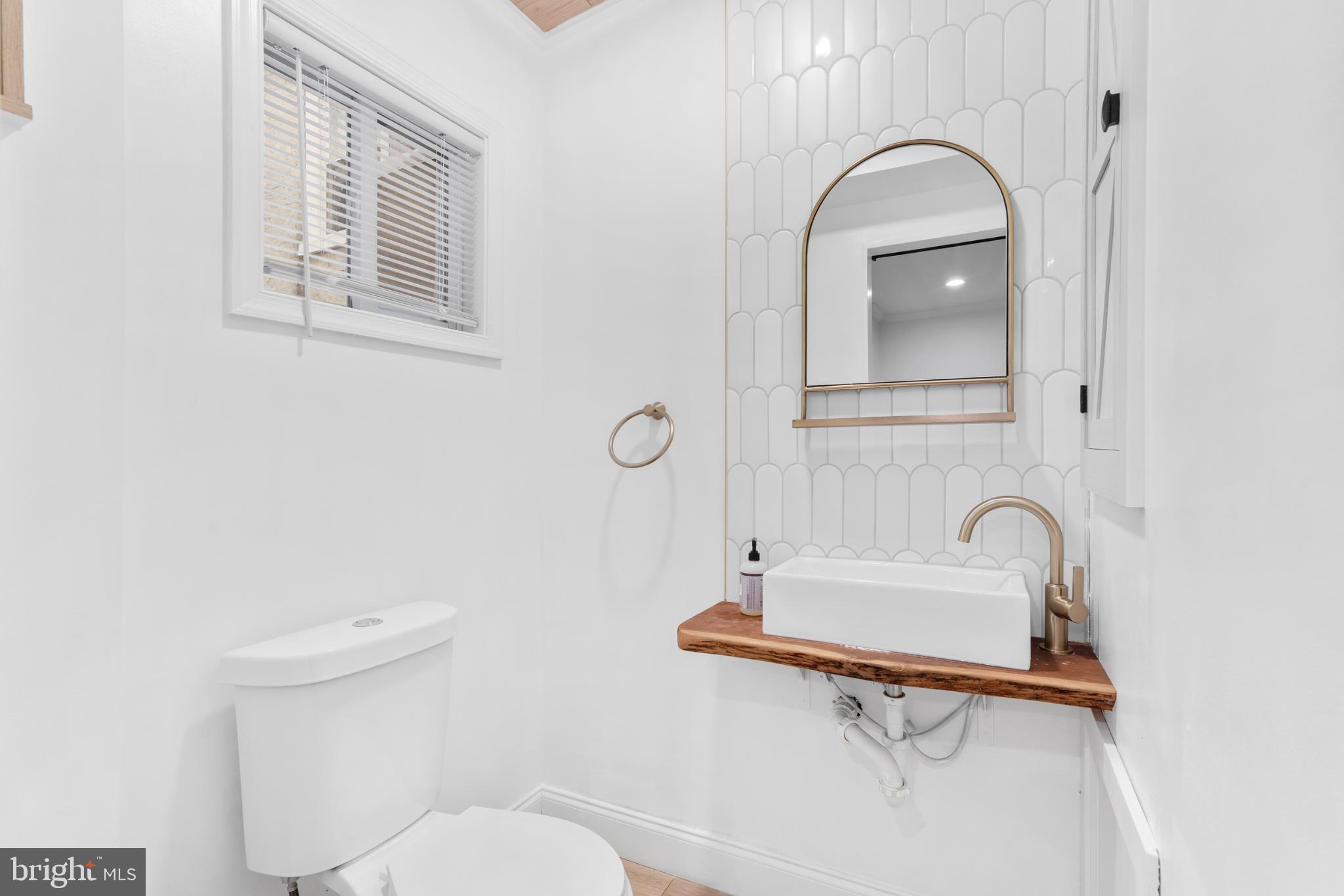 944 North Randolph Street Philadelphia, PA 19123 - Photo 9 of 26 a bathroom with a toilet a sink and mirror