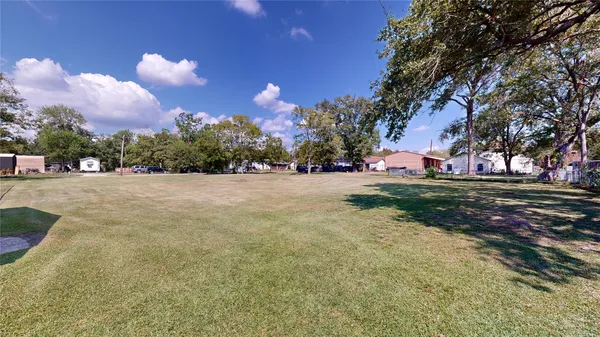 a view of a playground with basketball court