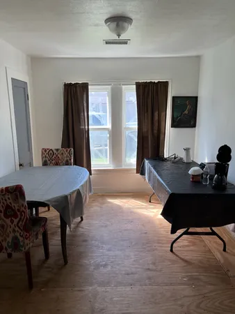 a workspace with furniture and window