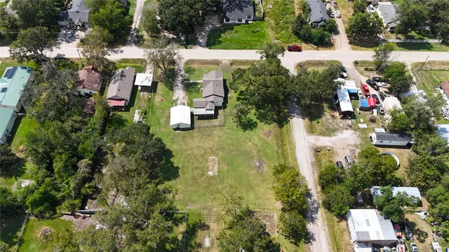 an aerial view of houses with yard