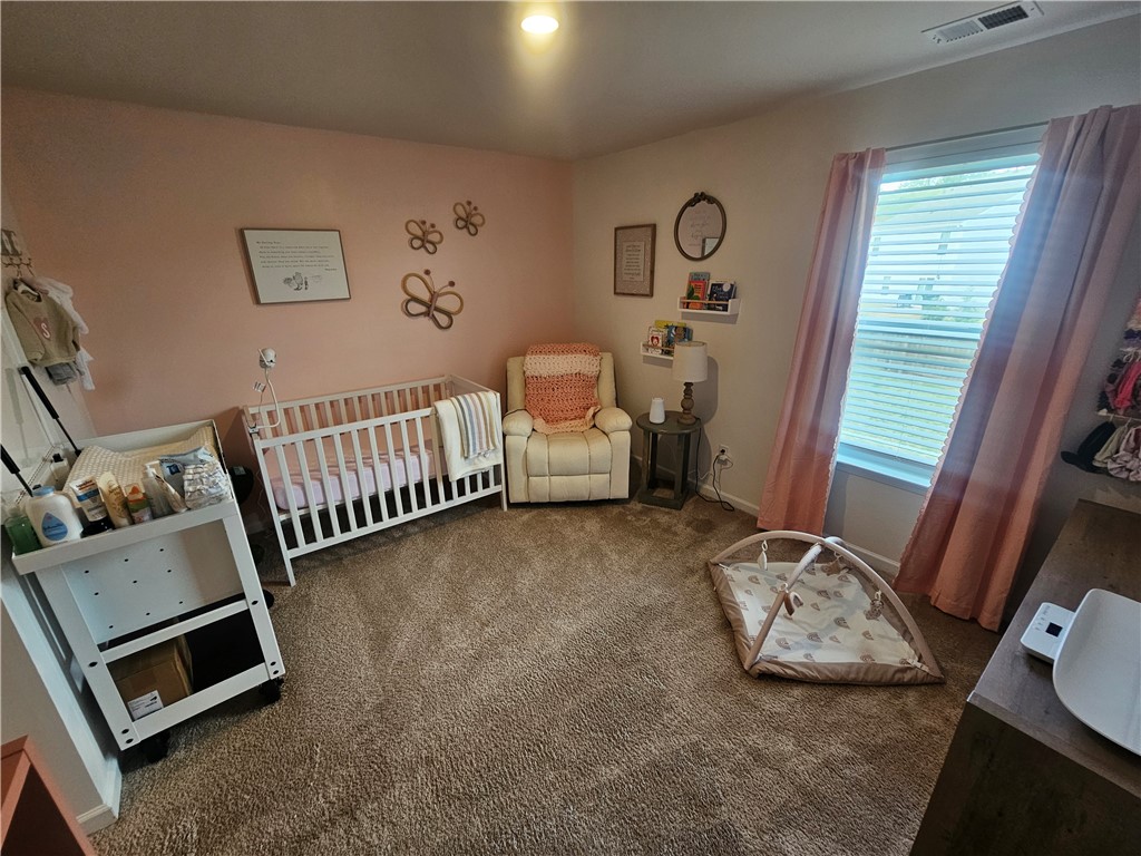 902 Ashwood Lane Easley, SC 29640 - Photo 32 of 39 A comforting nursery features plush carpeting, a cozy window, and ample space.