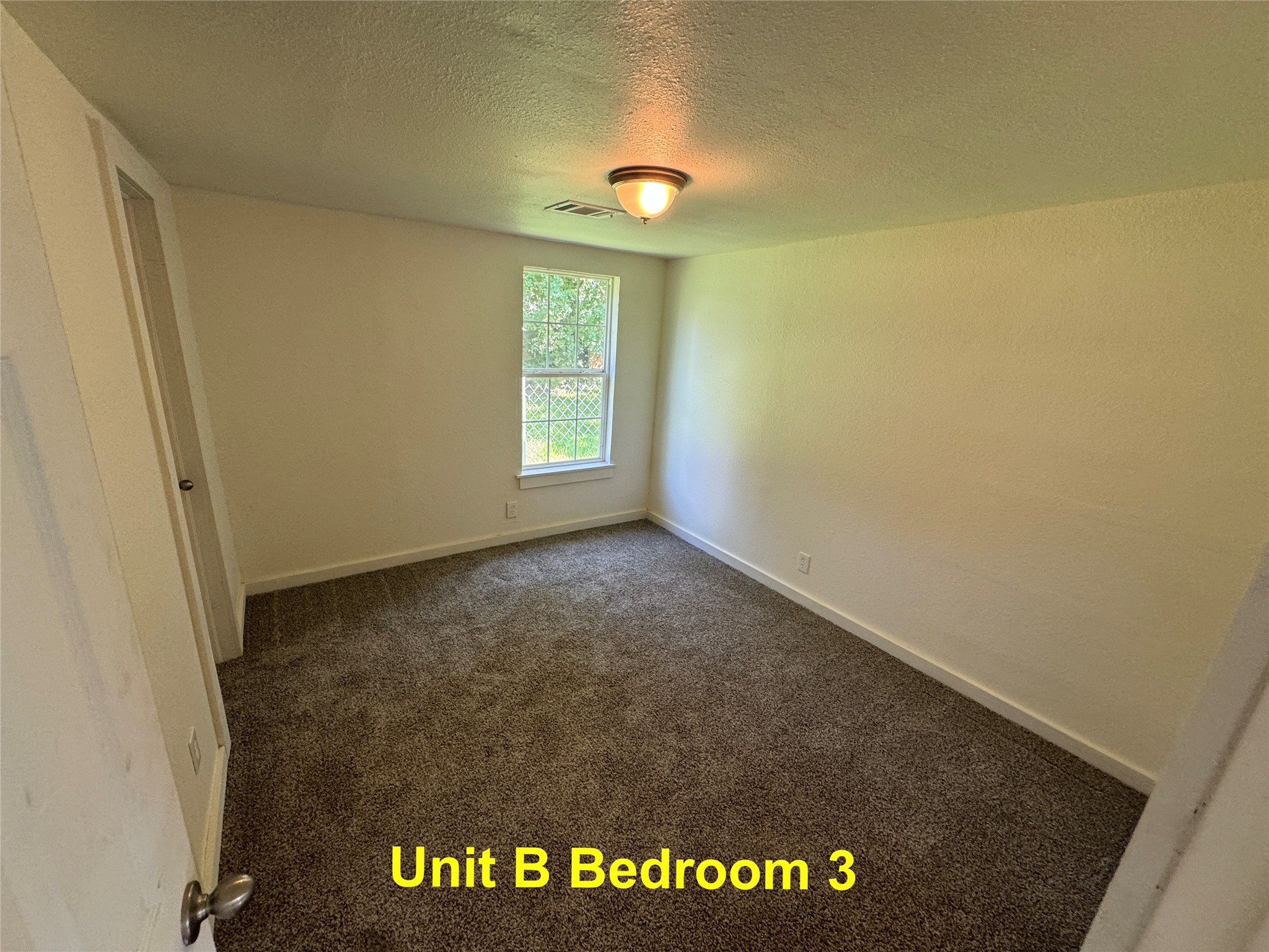 8214 Livingston Street, Unit A Houston, TX 77051 - Photo 11 of 17 a view of an empty room and a window