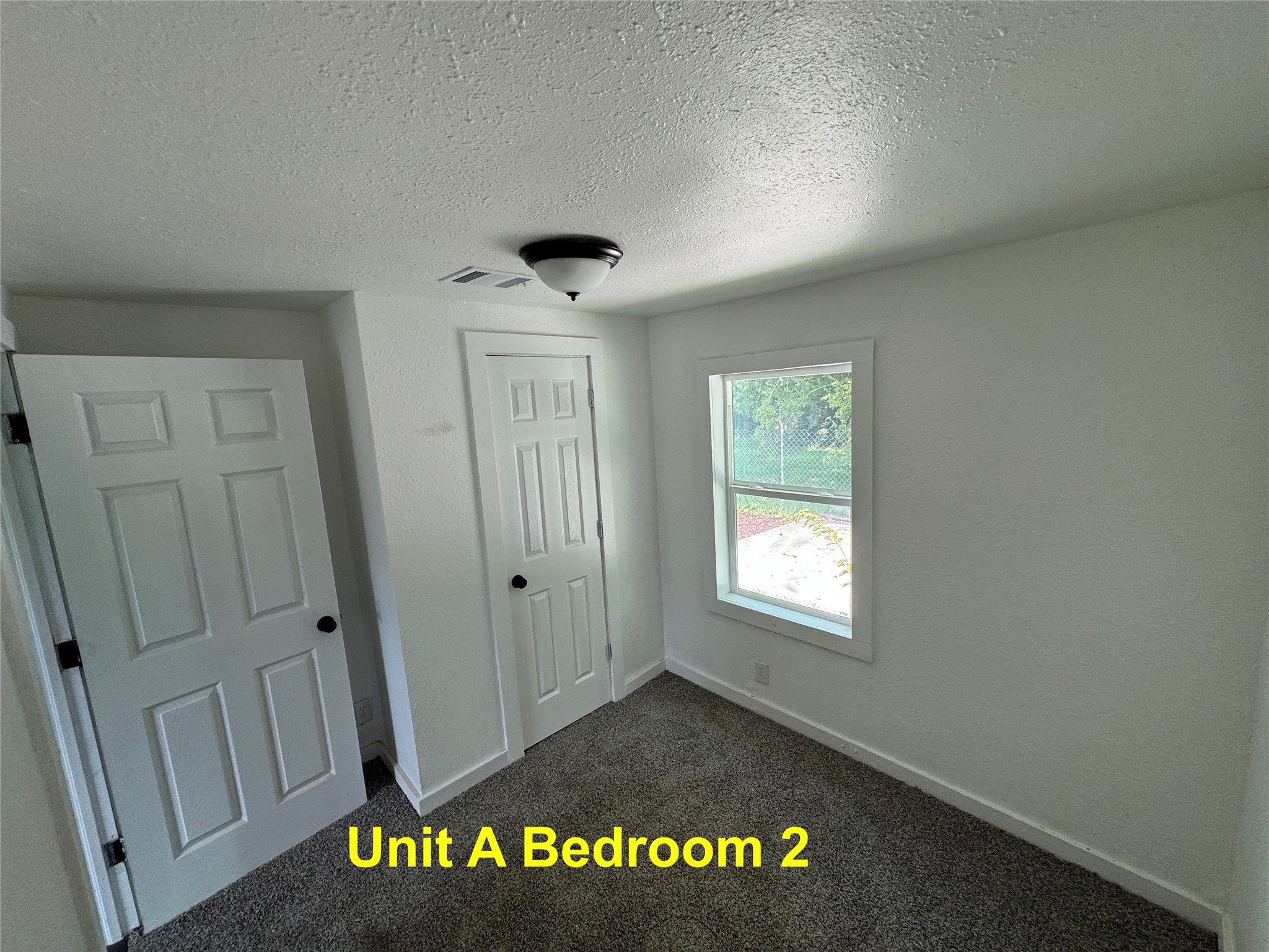 8214 Livingston Street, Unit A Houston, TX 77051 - Photo 7 of 17 a view of an empty room and a window