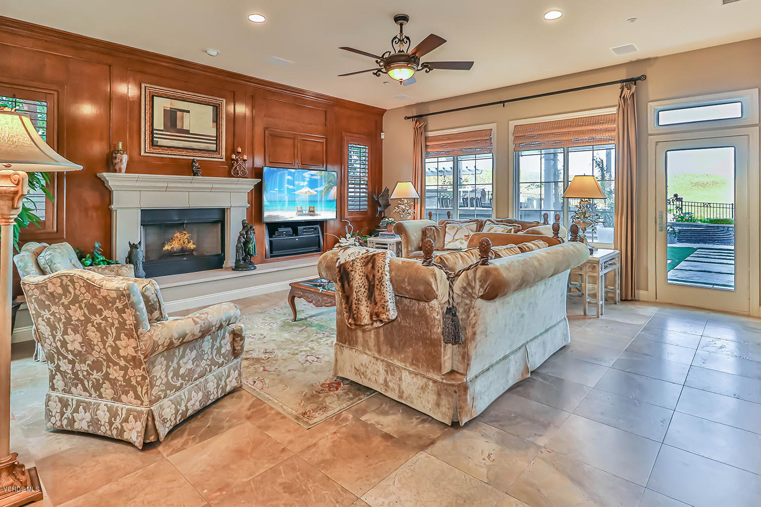 457 Vineyard Drive Simi Valley, CA 93065 - Photo 16 of 65 a living room with furniture large window and a fireplace
