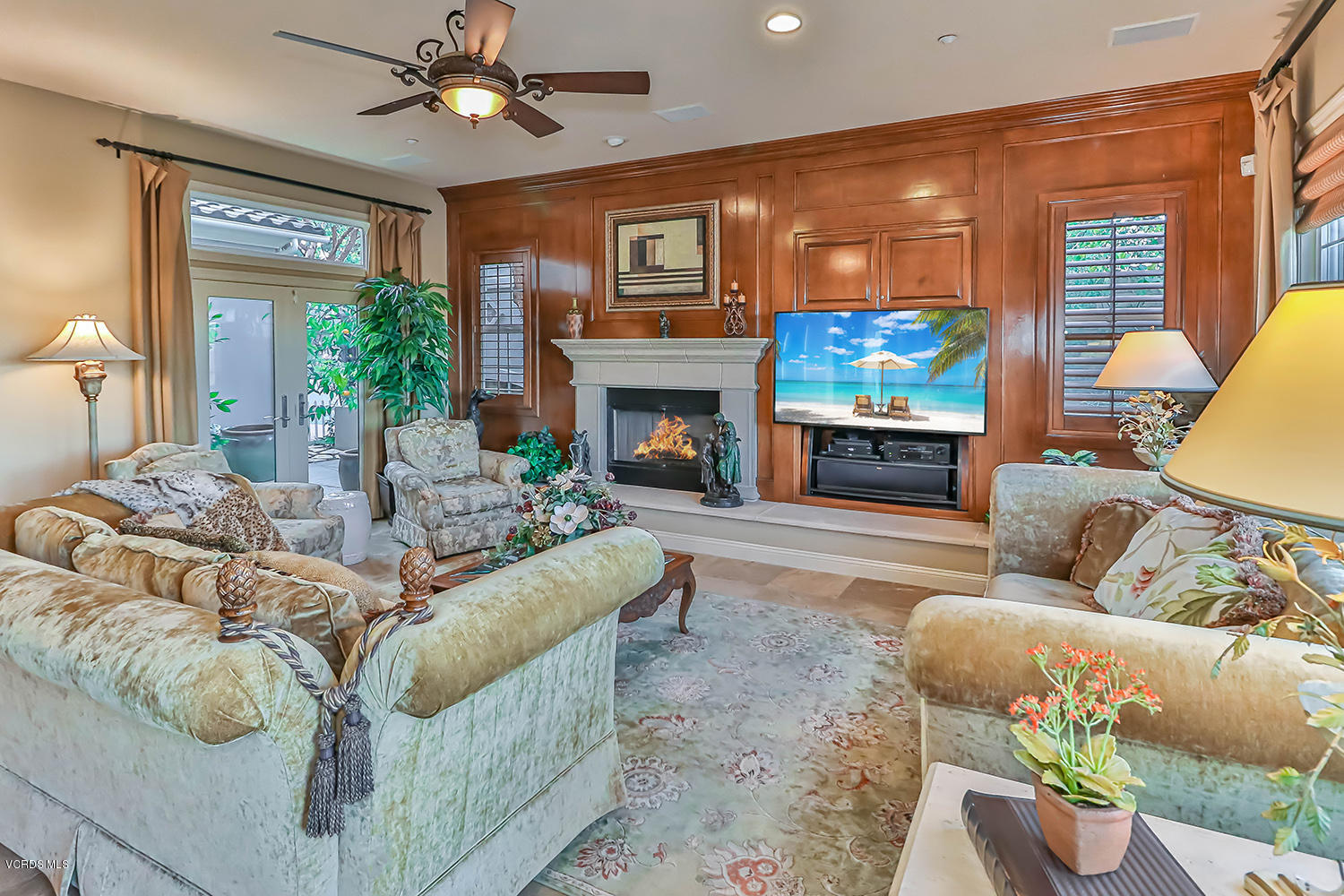 457 Vineyard Drive Simi Valley, CA 93065 - Photo 17 of 65 a living room with furniture a fireplace and a flat screen tv