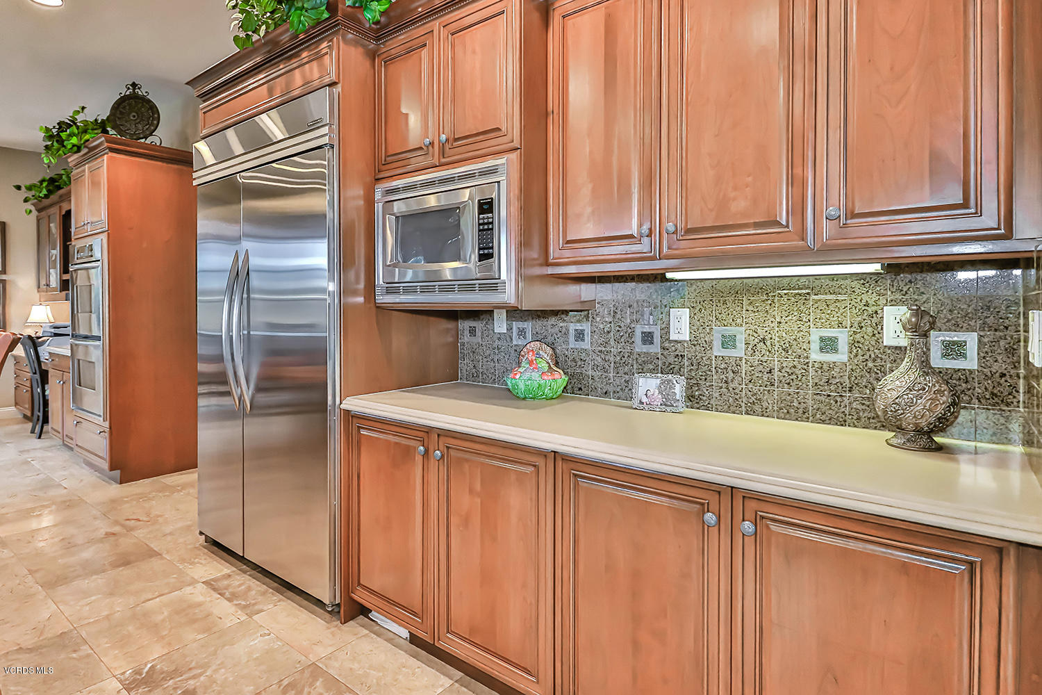 457 Vineyard Drive Simi Valley, CA 93065 - Photo 20 of 65 a kitchen with stainless steel appliances granite countertop a refrigerator and a sink