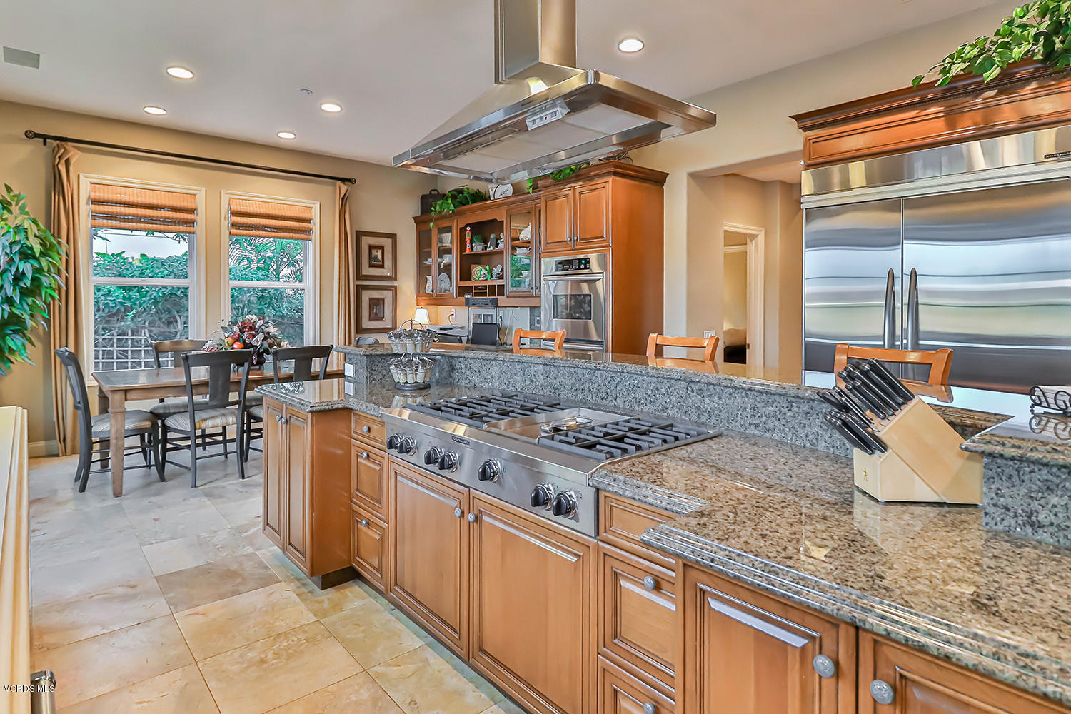 457 Vineyard Drive Simi Valley, CA 93065 - Photo 21 of 65 a kitchen with stainless steel appliances granite countertop a stove and a sink