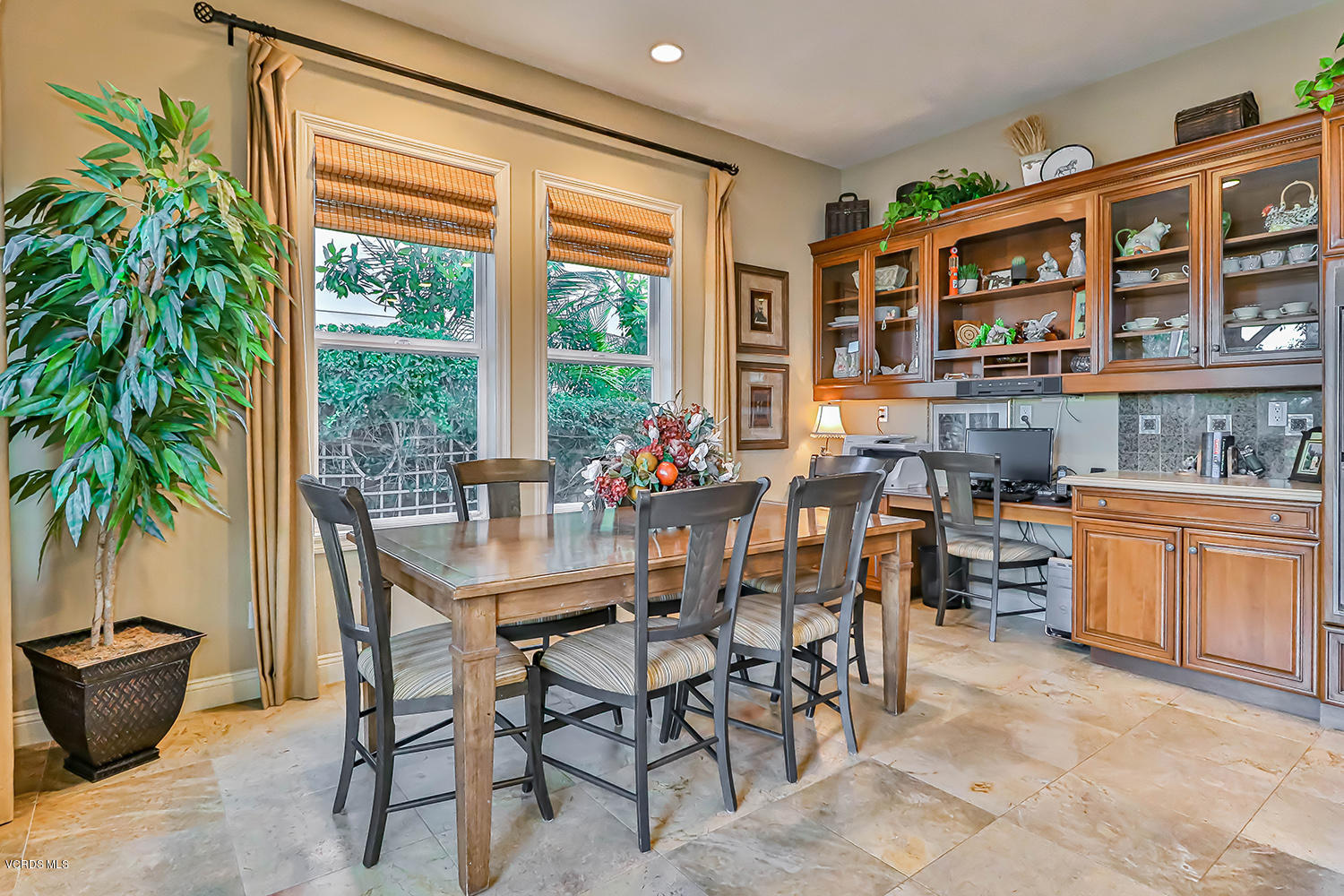 457 Vineyard Drive Simi Valley, CA 93065 - Photo 22 of 65 a dining room with stainless steel appliances a table and chairs in it