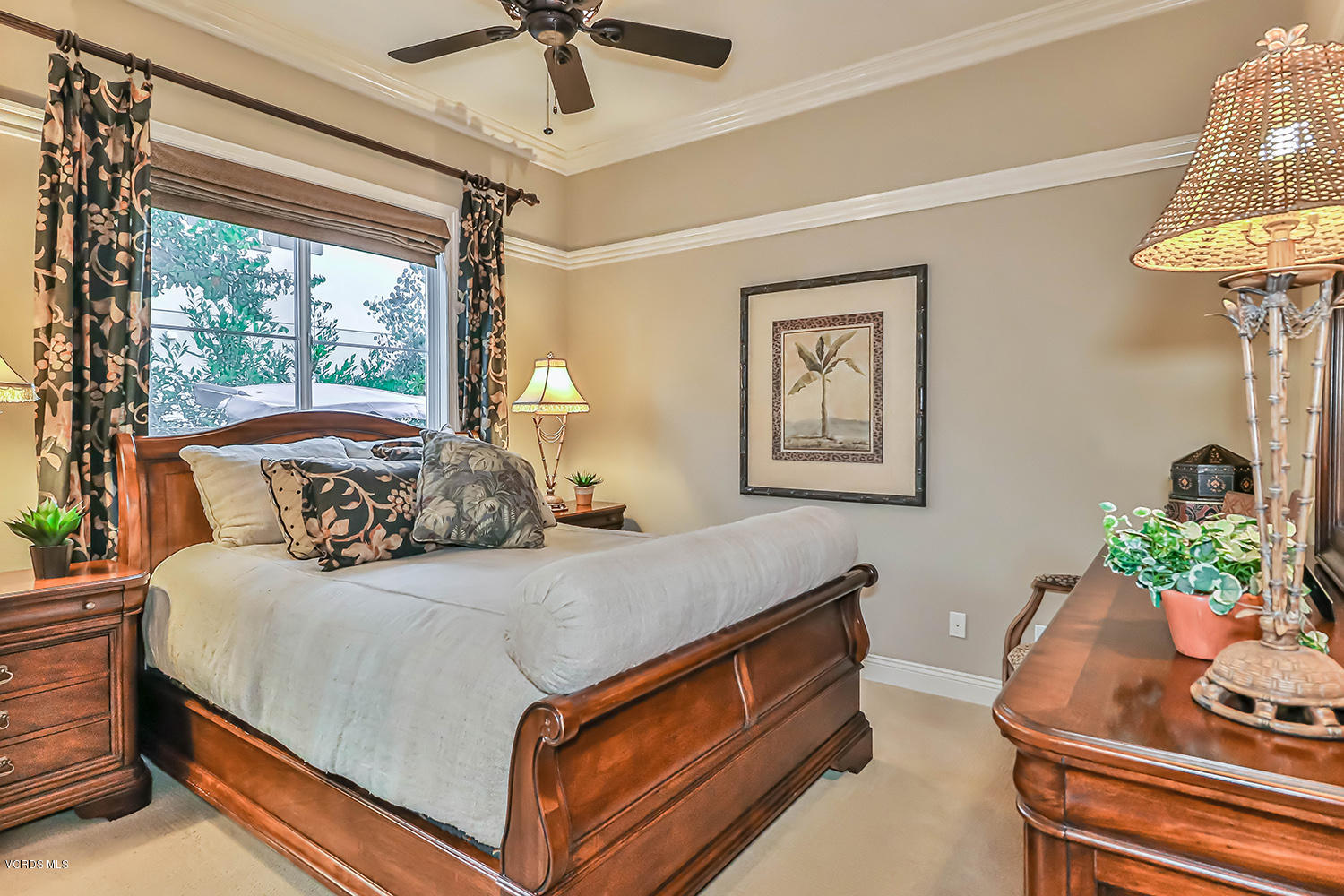 457 Vineyard Drive Simi Valley, CA 93065 - Photo 32 of 65 a bedroom with a bed and a chandelier
