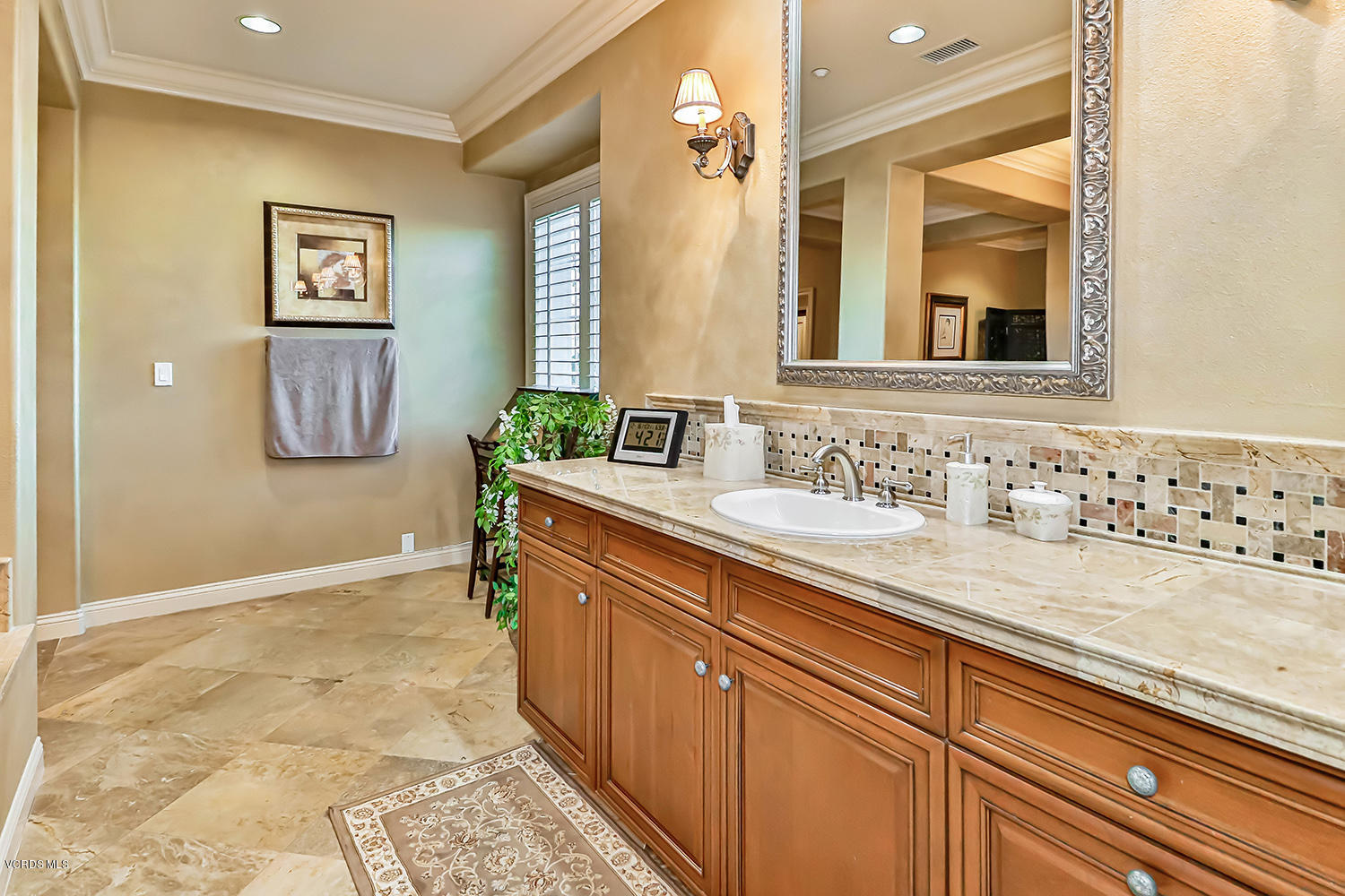 457 Vineyard Drive Simi Valley, CA 93065 - Photo 43 of 65 a bathroom with a sink and a mirror
