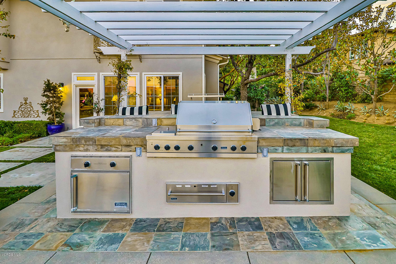 457 Vineyard Drive Simi Valley, CA 93065 - Photo 54 of 65 a view of a kitchen with kitchen island a stove and a large window