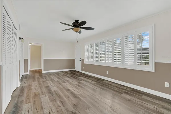 a kitchen with granite countertop cabinets and window