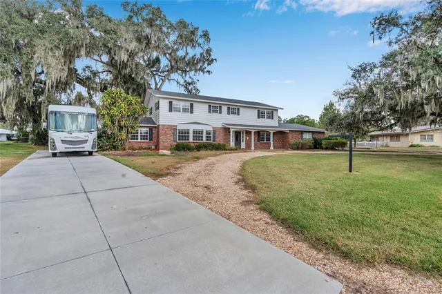 a front view of a building with a yard