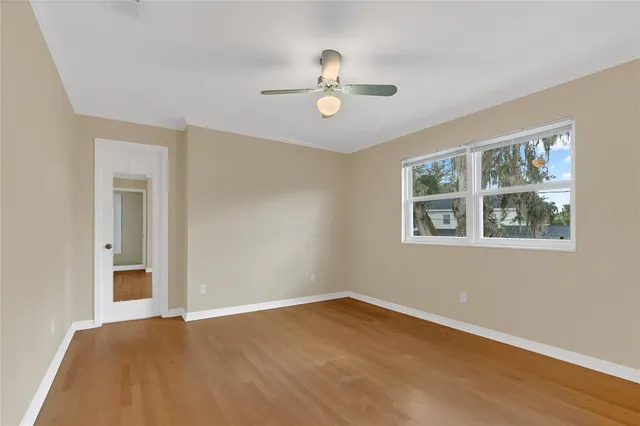 a view of a refrigerator in kitchen and cabinets