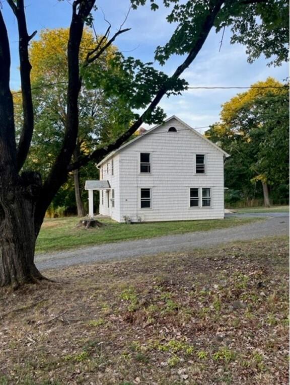 56-58 Still Road Monroe, NY 10950 - Photo 7 of 18 a house view with a backyard space