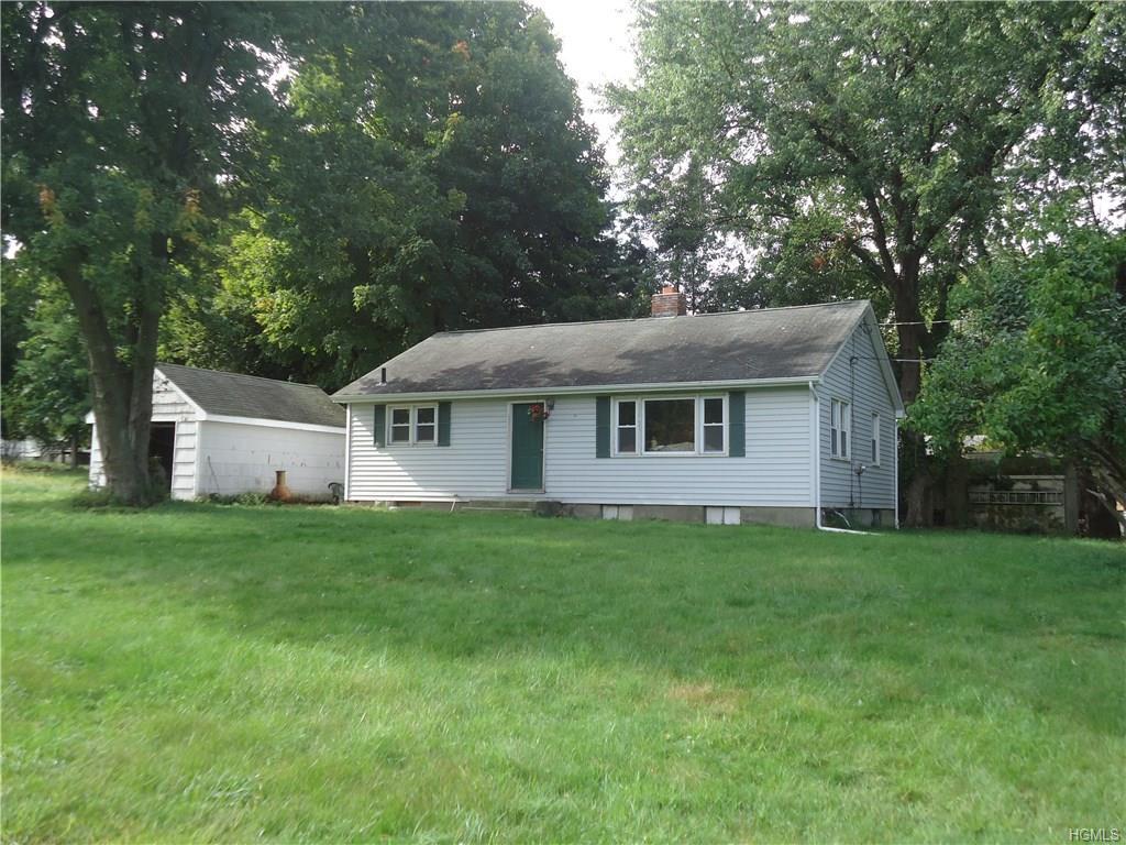 56-58 Still Road Monroe, NY 10950 - Photo 8 of 18 a front view of a house with a yard