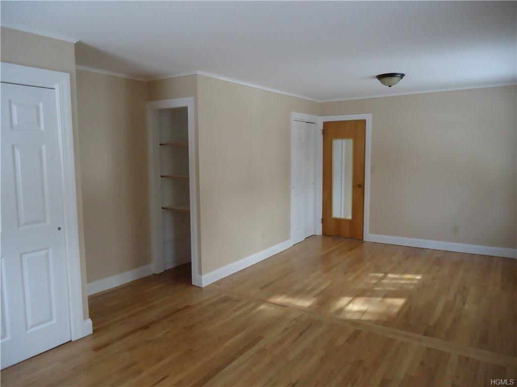 56-58 Still Road Monroe, NY 10950 - Photo 9 of 18 a view of an empty room and wooden floor