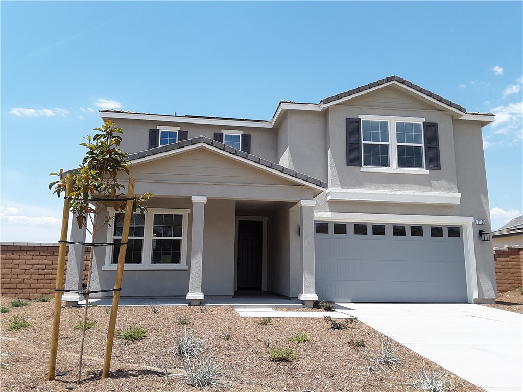 21108 Bison Mesa Road Riverside, CA 92507 - Photo 1 of 45 a front view of a house with a yard