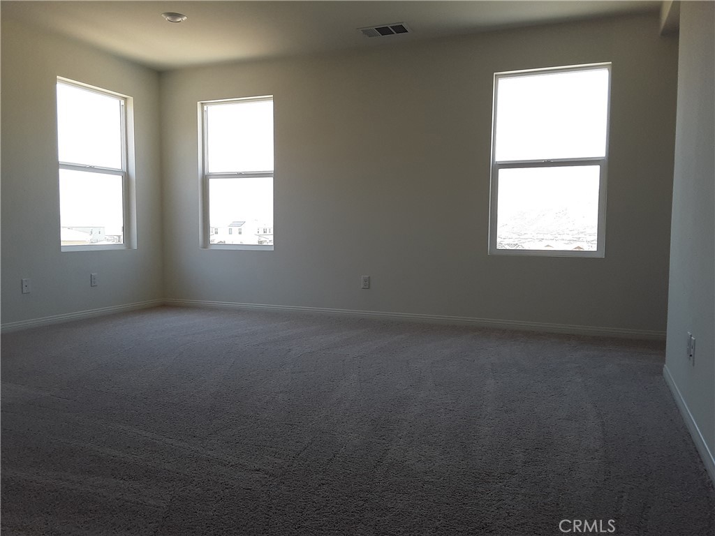 21108 Bison Mesa Road Riverside, CA 92507 - Photo 11 of 45 an empty room with a window