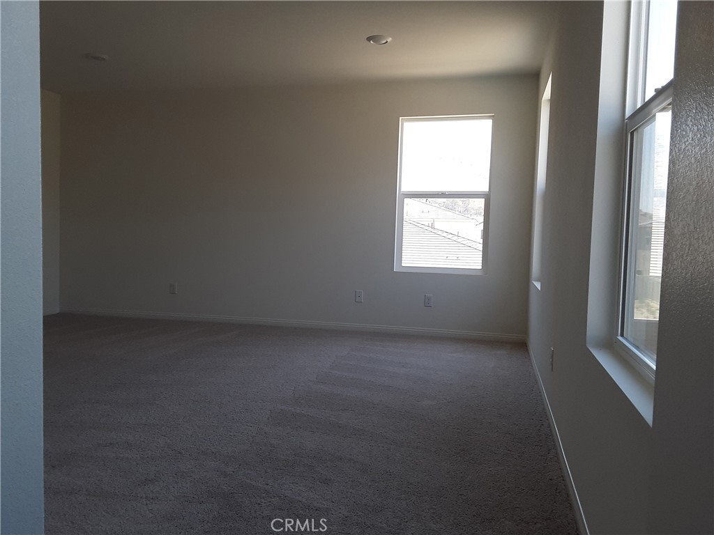 21108 Bison Mesa Road Riverside, CA 92507 - Photo 18 of 45 an empty room with windows