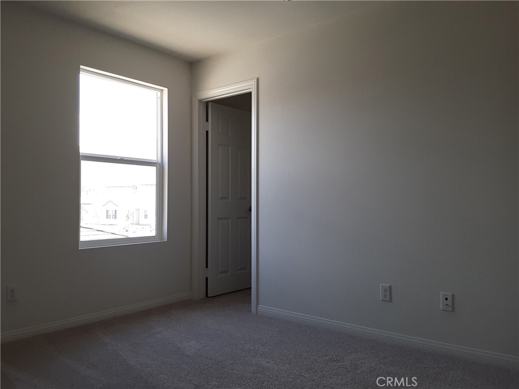 21108 Bison Mesa Road Riverside, CA 92507 - Photo 25 of 45 an empty room with a window