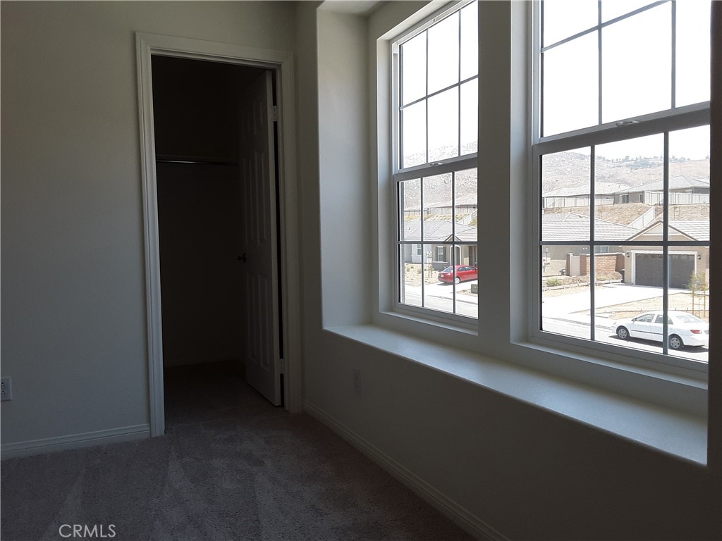 21108 Bison Mesa Road Riverside, CA 92507 - Photo 29 of 45 an empty room with a window