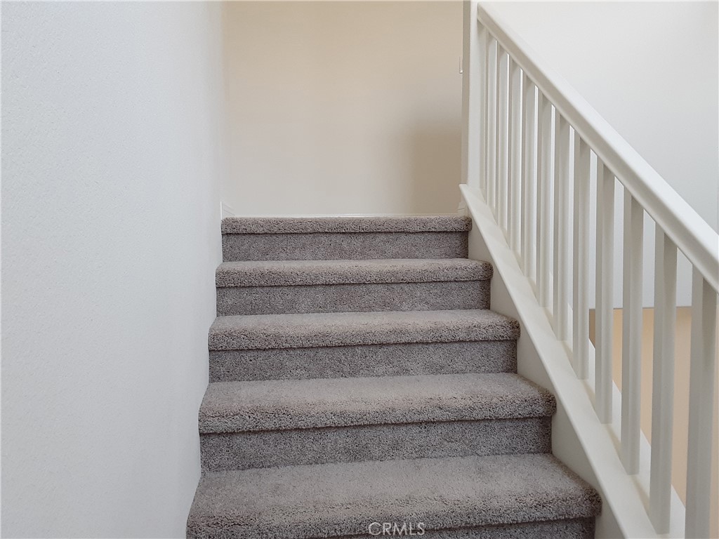 21108 Bison Mesa Road Riverside, CA 92507 - Photo 9 of 45 a view of staircase with white walls
