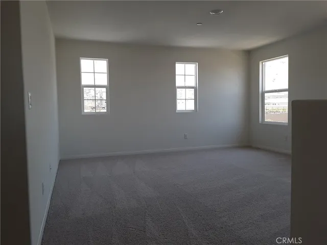an empty room that has a window