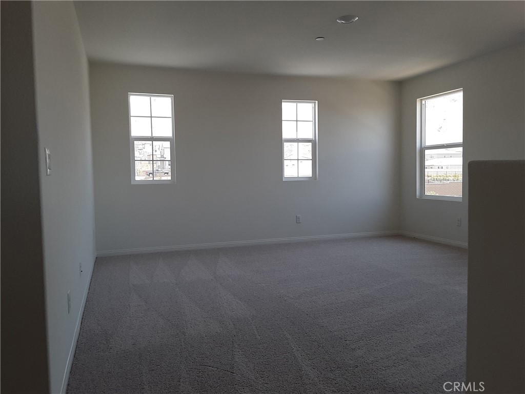 21108 Bison Mesa Road Riverside, CA 92507 - Photo 10 of 45 an empty room that has a window