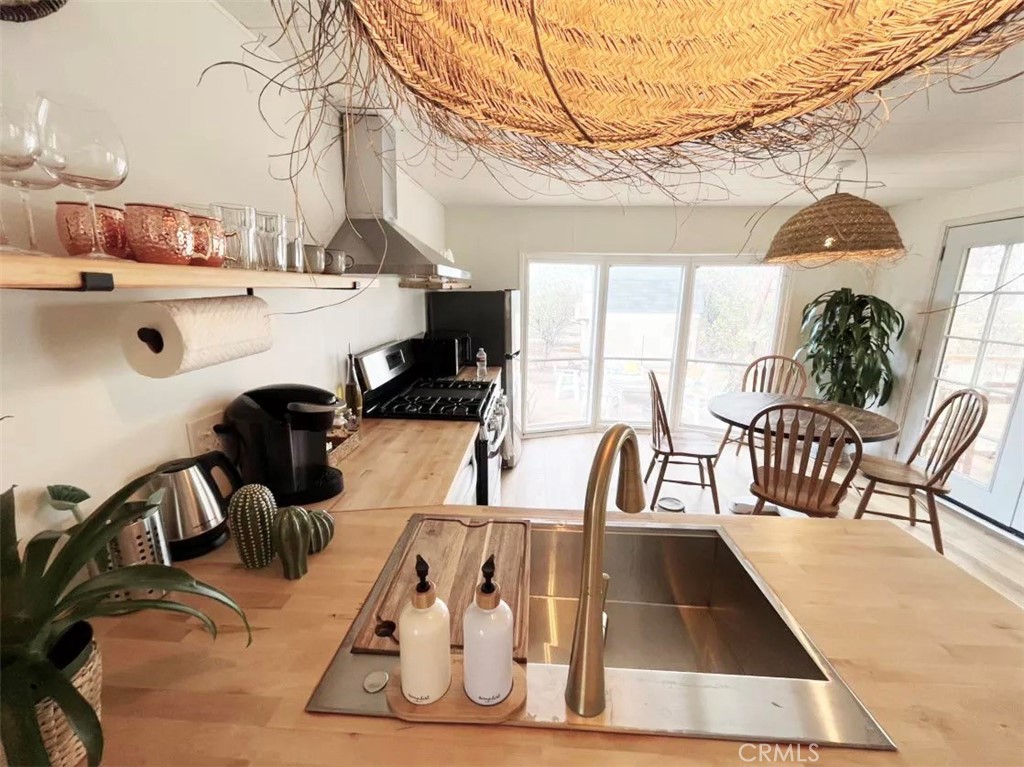 5238 Rice Avenue Joshua Tree, CA 92252 - Photo 2 of 41 a view of a swimming pool with a table and chairs