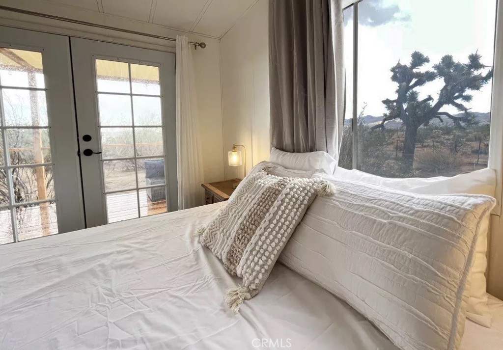 5238 Rice Avenue Joshua Tree, CA 92252 - Photo 6 of 41 a bedroom with a bed and a window