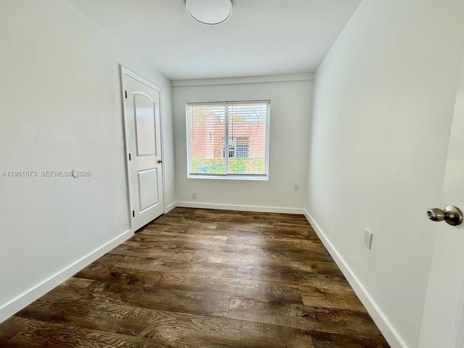 929 Southwest 12th Avenue, Unit 929 Miami, FL 33130 - Photo 11 of 18 a view of an empty room and window
