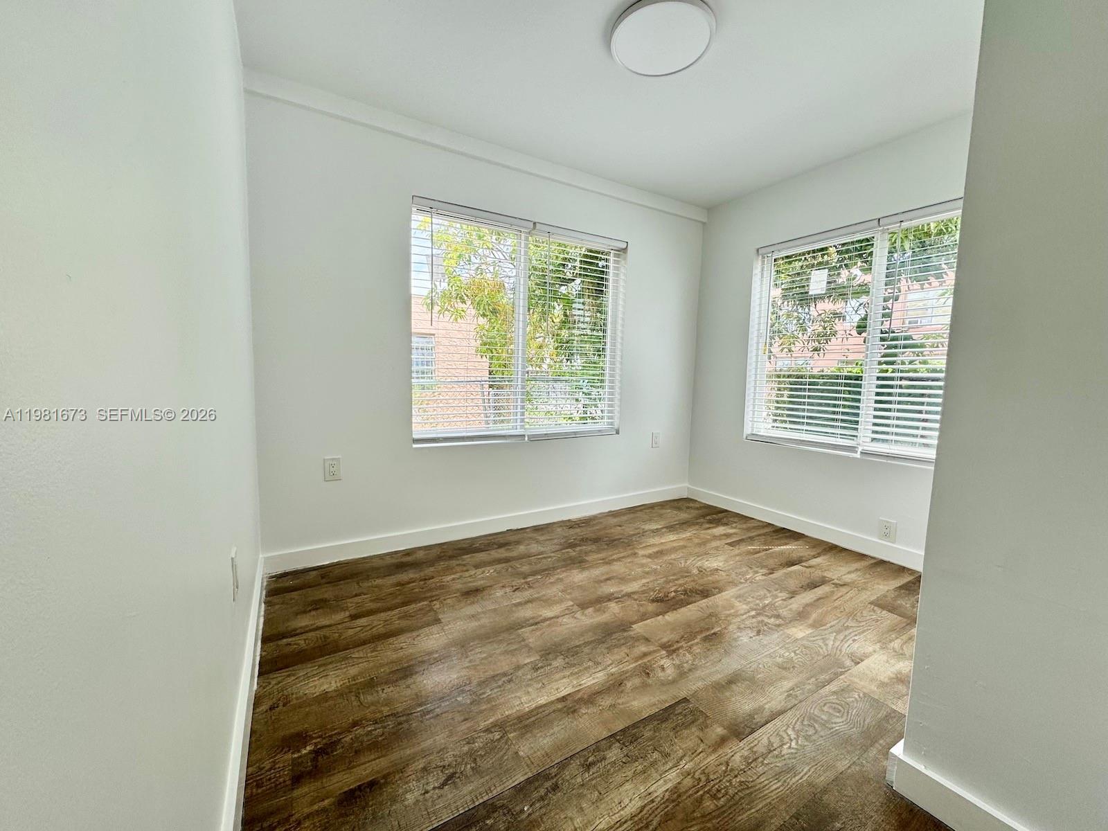 929 Southwest 12th Avenue, Unit 929 Miami, FL 33130 - Photo 12 of 18 a view of an empty room with a window