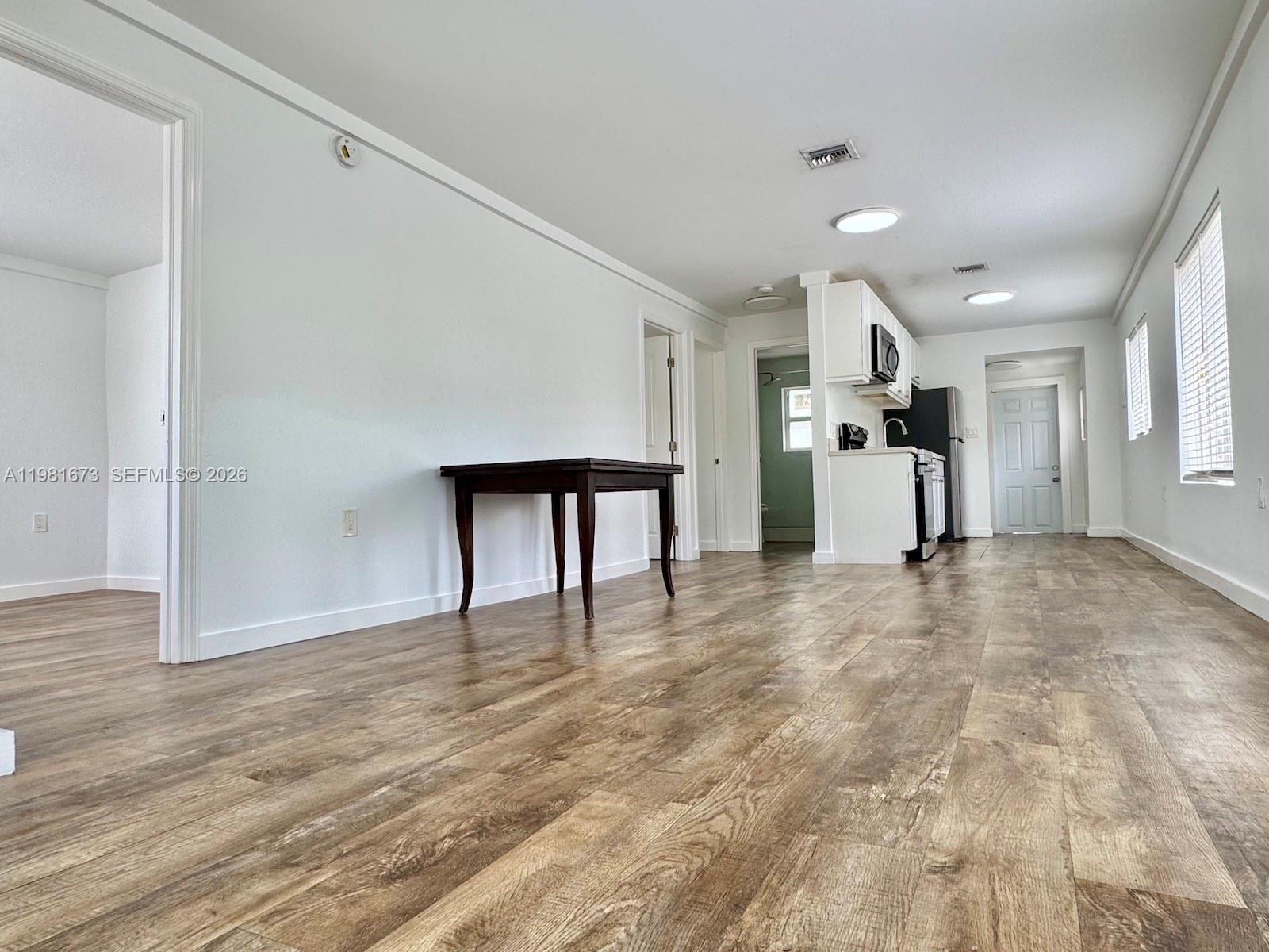 929 Southwest 12th Avenue, Unit 929 Miami, FL 33130 - Photo 15 of 18 a view of empty room with wooden floor
