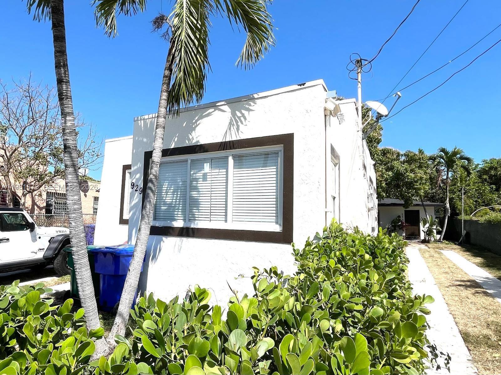 929 Southwest 12th Avenue, Unit 929 Miami, FL 33130 - Photo 3 of 18 a front view of a house with a yard