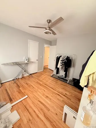 a bedroom with a bed and cabinets