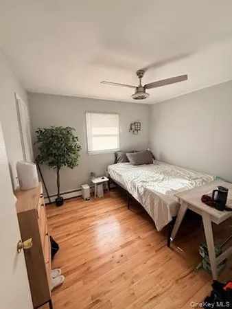a bedroom with a bed furniture and a window