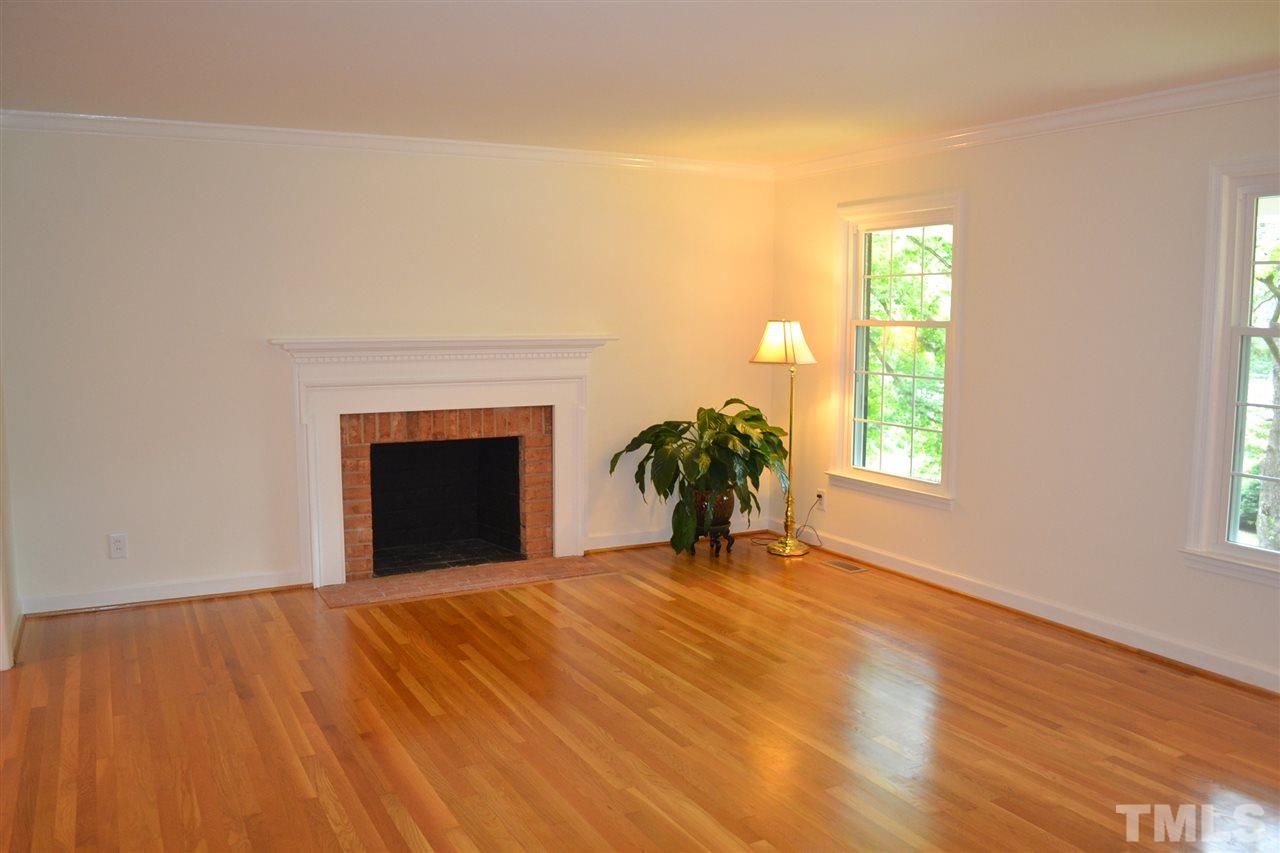 4208 Union Street Raleigh, NC 27609 - Photo 8 of 24 a view of an empty room with a window and fire place