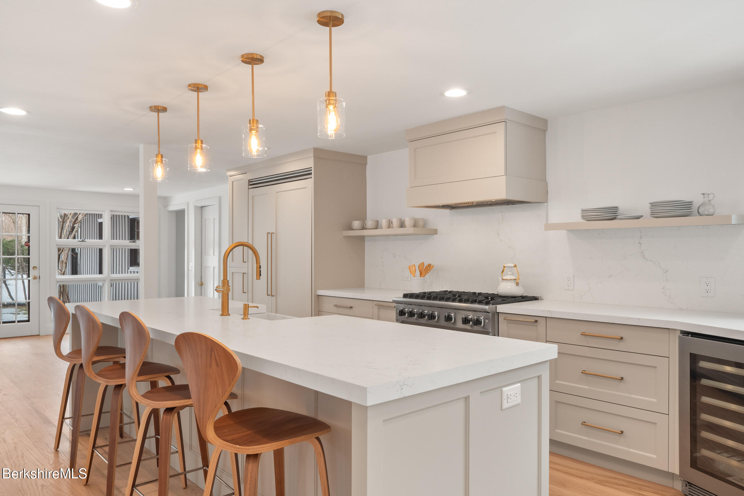 14 Pinecrest Cross Road Egremont, MA 01230 - Photo 11 of 40 a kitchen that has a stove a table and chairs in it