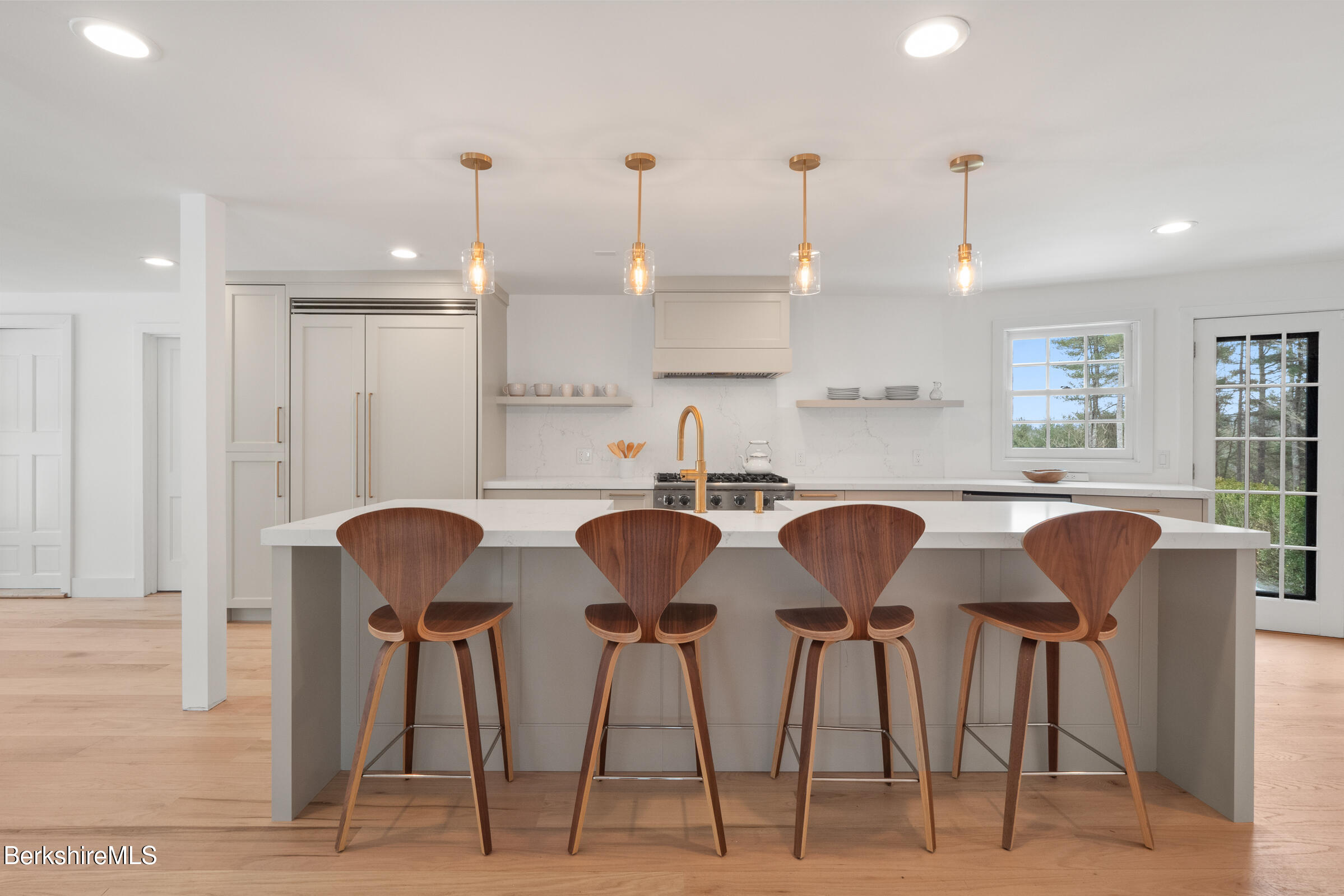 14 Pinecrest Cross Road Egremont, MA 01230 - Photo 13 of 40 a kitchen with granite countertop cabinets and chairs