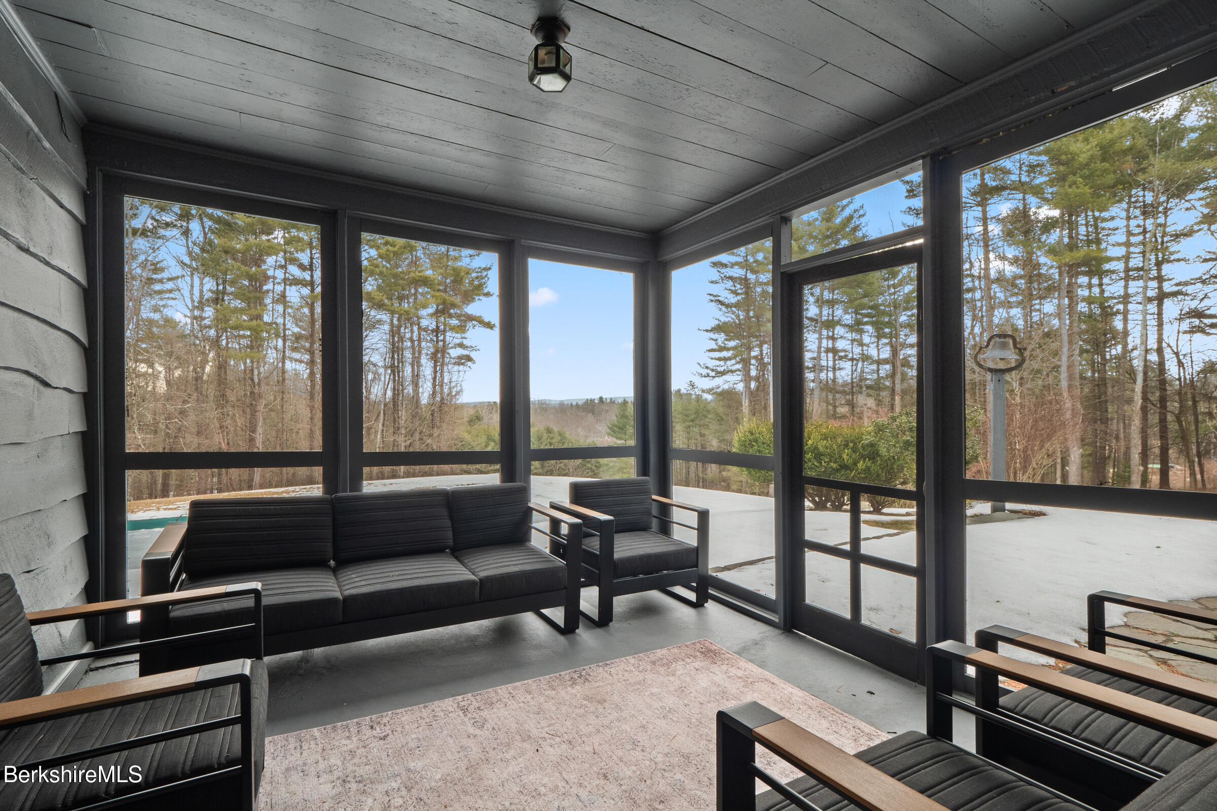 14 Pinecrest Cross Road Egremont, MA 01230 - Photo 17 of 40 a living room with furniture and a floor to ceiling window